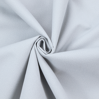 A Merida Suede upholstery fabric in a light silver colour.