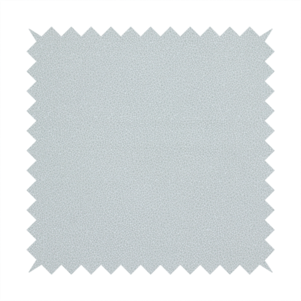 A Merida Suede upholstery fabric in a light grey colour.