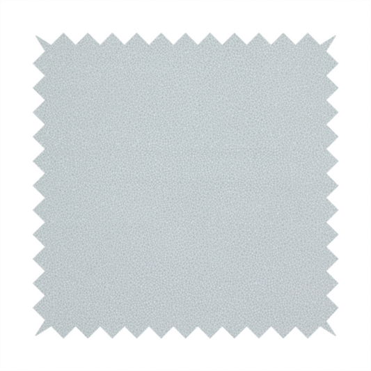 A Merida Suede upholstery fabric in a light grey colour.