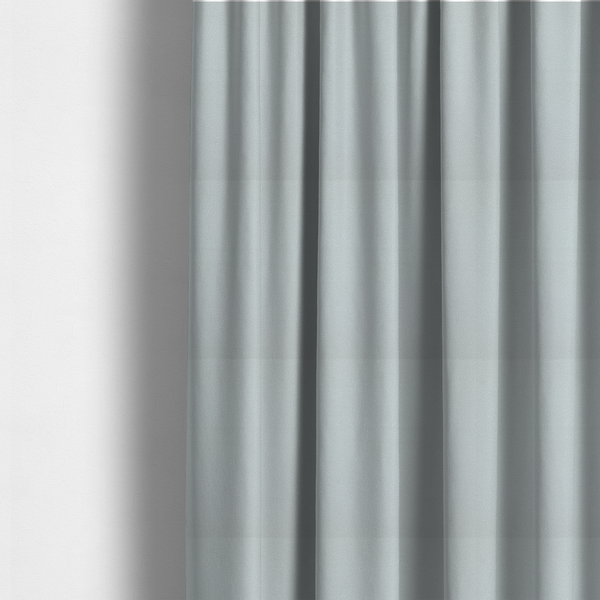 The fabric used to create these made-to-measure curtains is a Merida Suede upholstery fabric in a light grey colour.