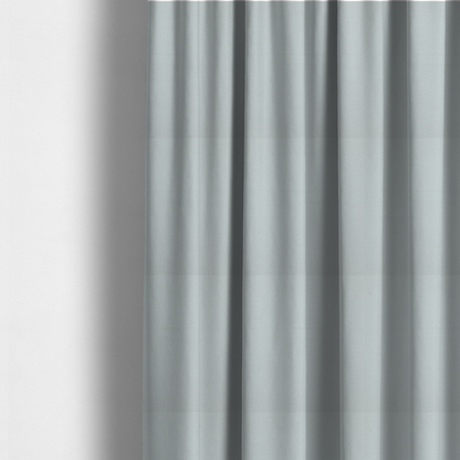 The fabric used to create these made-to-measure curtains is a Merida Suede upholstery fabric in a light grey colour.