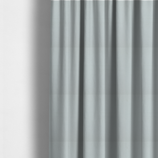 The fabric used to create these made-to-measure curtains is a Merida Suede upholstery fabric in a light grey colour.