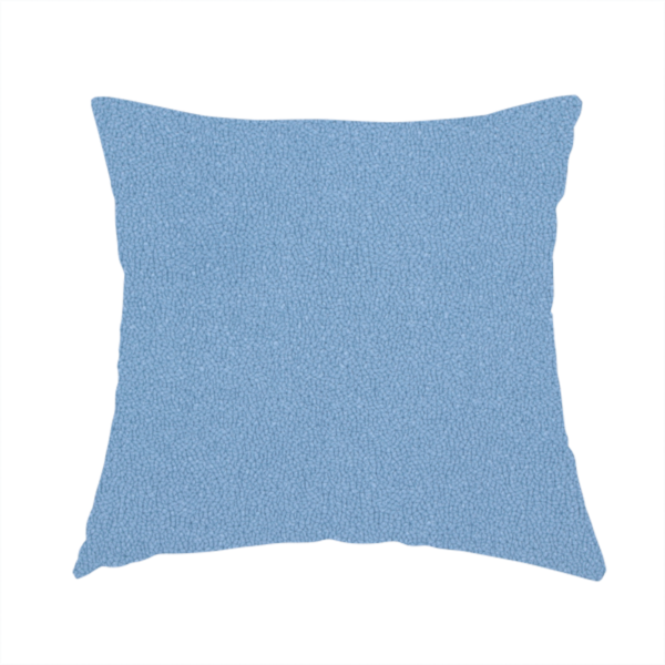 The fabric used to create this handmade cushion is a Merida Suede upholstery fabric in a soft, medium sky blue colour.