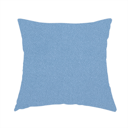 The fabric used to create this handmade cushion is a Merida Suede upholstery fabric in a soft, medium sky blue colour.