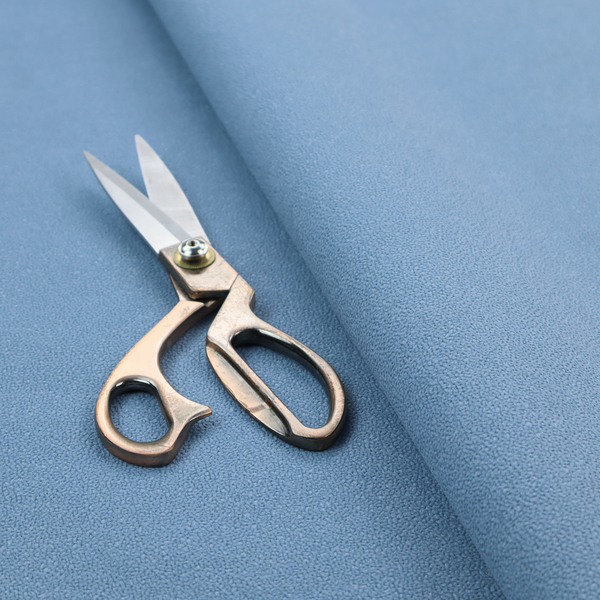 Merida Suede upholstery fabric in a soft, medium sky blue colour.