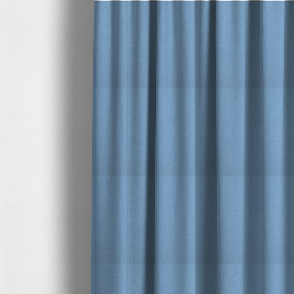 The fabric used to create these made-to-measure curtains is a Merida Suede upholstery fabric in a soft, medium sky blue colour.