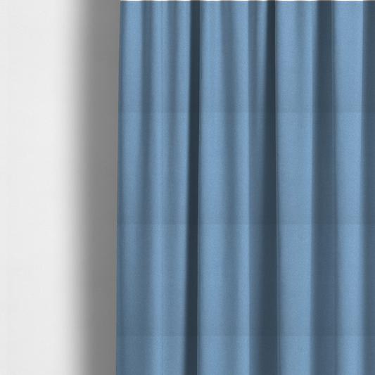 The fabric used to create these made-to-measure curtains is a Merida Suede upholstery fabric in a soft, medium sky blue colour.
