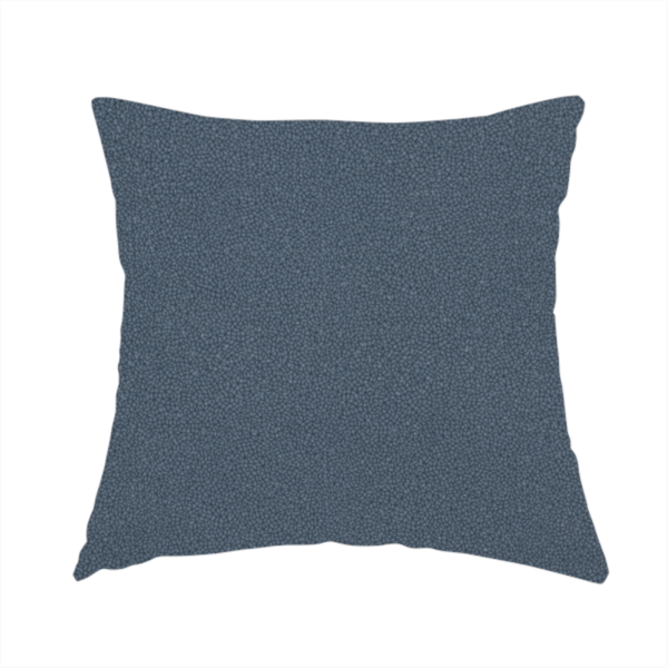 The fabric used to create this handmade cushion is a Merida Suede upholstery fabric in a muted slate blue or denim blue colour.