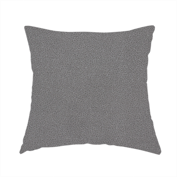 The fabric used to create this handmade cushion is a Merida Suede upholstery fabric in a medium charcoal grey colour.