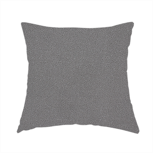 The fabric used to create this handmade cushion is a Merida Suede upholstery fabric in a medium charcoal grey colour.