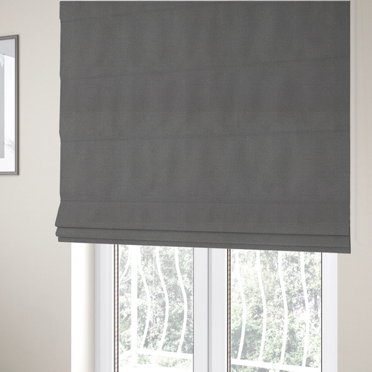 The fabric used to create these Roman blinds is a Merida Suede upholstery fabric in a medium charcoal grey colour.