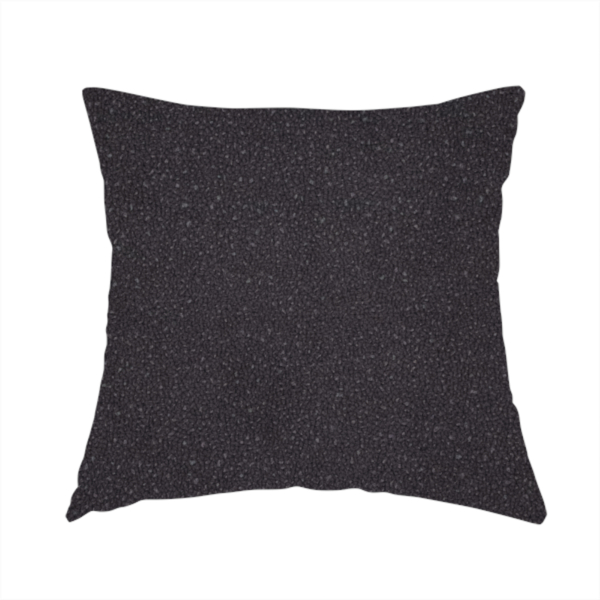 The fabric used to create this handmade cushion is a Merida Suede upholstery fabric in a dark purple or deep plum colour.