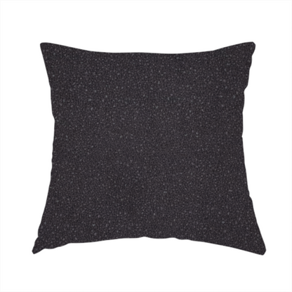 The fabric used to create this handmade cushion is a Merida Suede upholstery fabric in a dark purple or deep plum colour.
