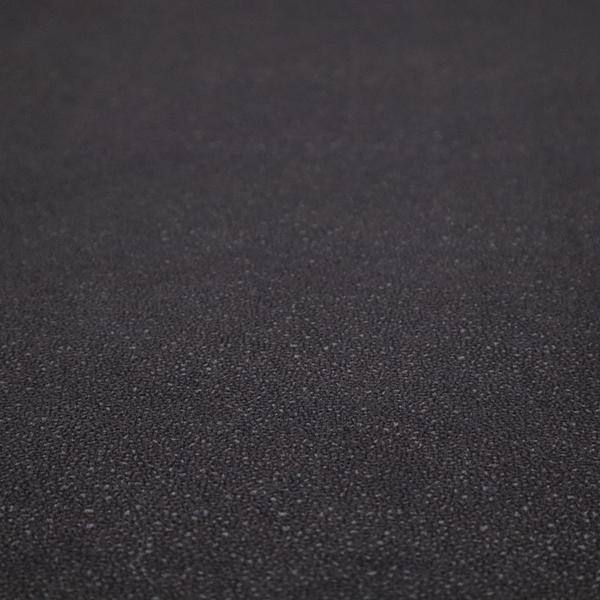 Merida Suede upholstery fabric in a dark purple or deep plum colour.