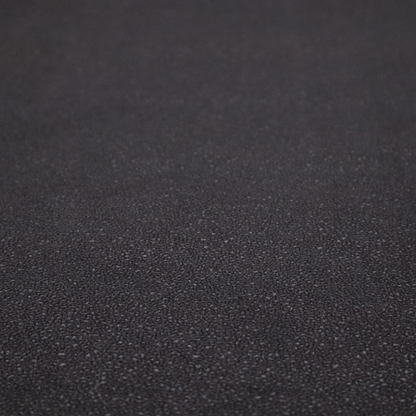 Merida Suede upholstery fabric in a dark purple or deep plum colour.