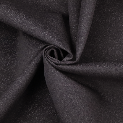 Merida Suede upholstery fabric in a dark purple or deep plum colour.