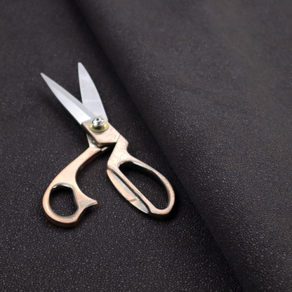 Merida Suede upholstery fabric in a dark purple or deep plum colour.