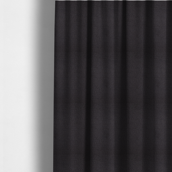 The fabric used to create these made-to-measure curtains is a Merida Suede upholstery fabric in a dark purple or deep plum colour.