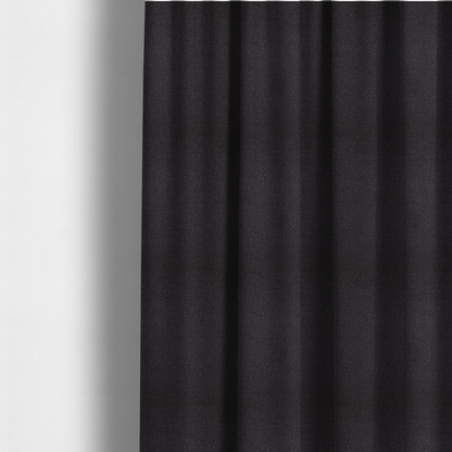 The fabric used to create these made-to-measure curtains is a Merida Suede upholstery fabric in a dark purple or deep plum colour.