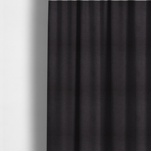 The fabric used to create these made-to-measure curtains is a Merida Suede upholstery fabric in a dark purple or deep plum colour.