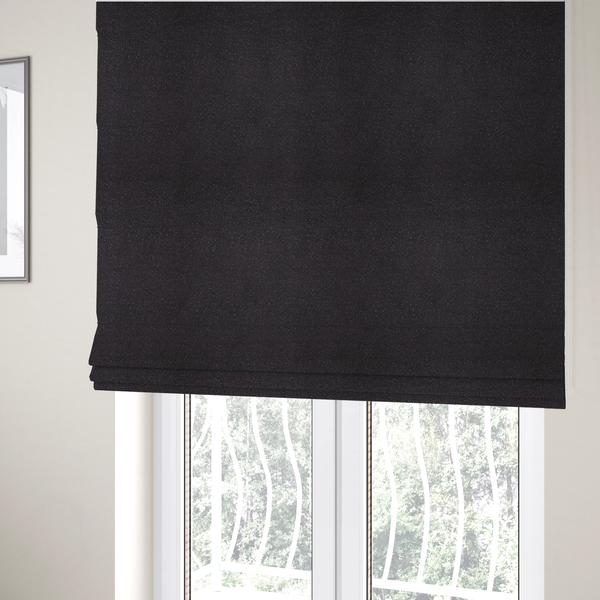 The fabric used to create these Roman blinds is a Merida Suede upholstery fabric in a dark purple or deep plum colour.