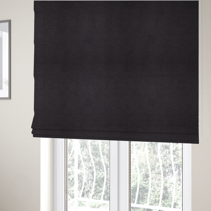 The fabric used to create these Roman blinds is a Merida Suede upholstery fabric in a dark purple or deep plum colour.