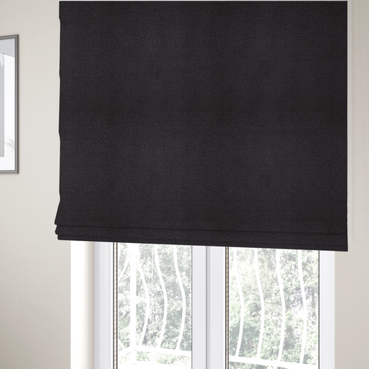 The fabric used to create these Roman blinds is a Merida Suede upholstery fabric in a dark purple or deep plum colour.