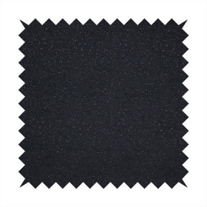 Merida Suede upholstery fabric in a deep charcoal grey or off-black colour.