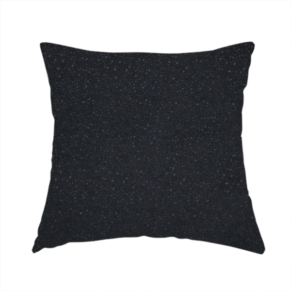 The fabric used to create this handmade cushion is a Merida Suede upholstery fabric in a deep charcoal grey or off-black colour.