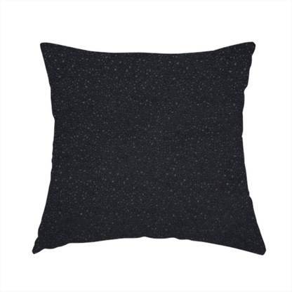The fabric used to create this handmade cushion is a Merida Suede upholstery fabric in a deep charcoal grey or off-black colour.