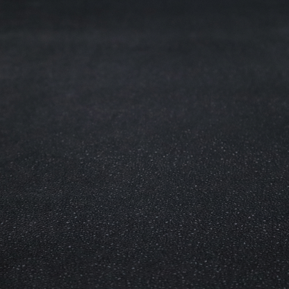 Merida Suede upholstery fabric in a deep charcoal grey or off-black colour.