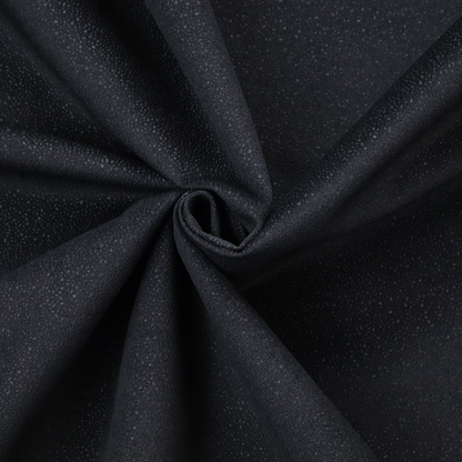 Merida Suede upholstery fabric in a deep charcoal grey or off-black colour.