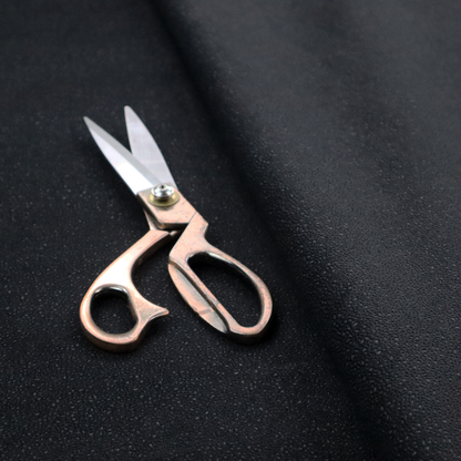 Merida Suede upholstery fabric in a deep charcoal grey or off-black colour.