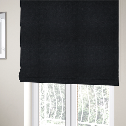 The fabric used to create these Roman blinds is a Merida Suede upholstery fabric in a deep charcoal grey or off-black colour.