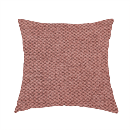 The fabric used to create this handmade cushion is a finely textured weave in a soft, dusty rose or blush pink shade. The material has a subtle heathered appearance with fine variations of lighter pink and darker undertones throughout.
