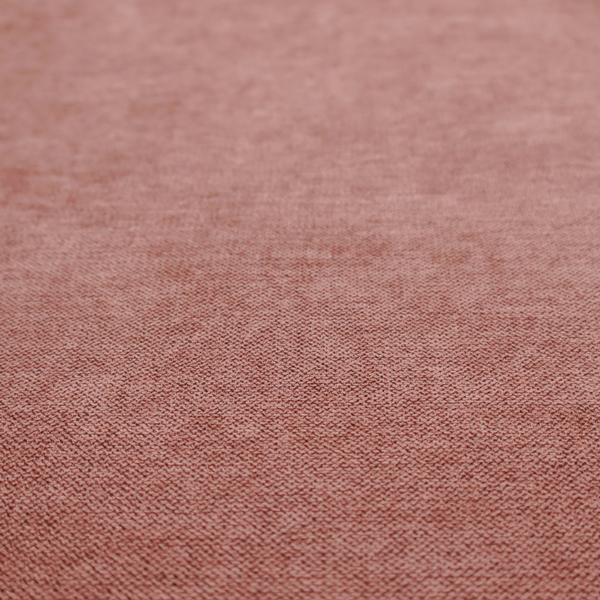 A finely textured weave in a soft, dusty rose or blush pink shade. The material has a subtle heathered appearance with fine variations of lighter pink and darker undertones throughout.