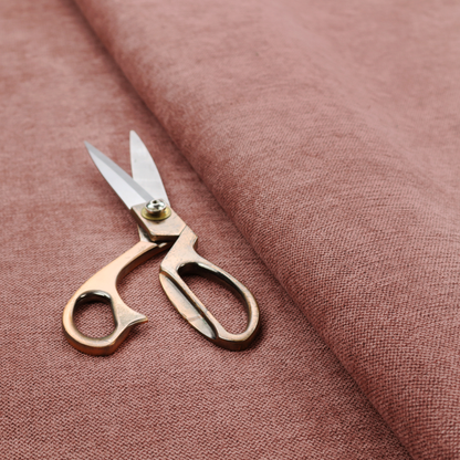 A finely textured weave in a soft, dusty rose or blush pink shade. The material has a subtle heathered appearance with fine variations of lighter pink and darker undertones throughout.