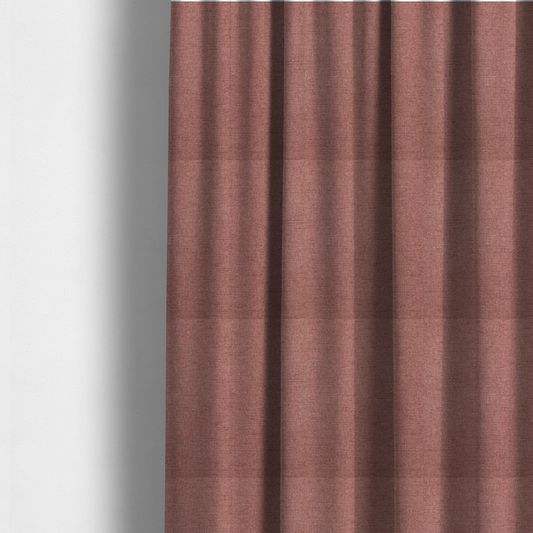 The fabric used to create these made-to-measure curtains is a finely textured weave in a soft, dusty rose or blush pink shade. The material has a subtle heathered appearance with fine variations of lighter pink and darker undertones throughout.
