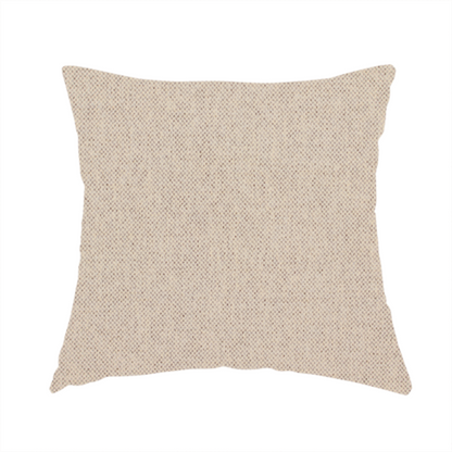 The fabric used to create this handmade cushion is a finely textured weave in a soft cream or light ivory shade. The material features a subtle heathered look with tiny flecks of beige and neutral undertones throughout.