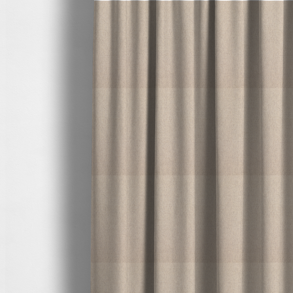 The fabric used to create these made-to-measure curtains is a finely textured weave in a soft cream or light ivory shade. The material features a subtle heathered look with tiny flecks of beige and neutral undertones throughout.
