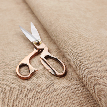 A finely textured weave in a sandy tan or camel shade. The material features a subtle heathered look with mixed light brown, cream, and neutral undertones throughout.