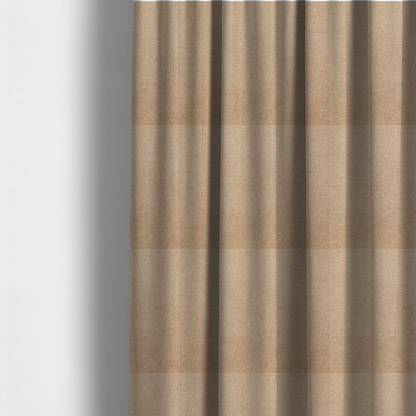 The fabric used to create these made-to-measure curtains is a finely textured weave in a sandy tan or camel shade. The material features a subtle heathered look with mixed light brown, cream, and neutral undertones throughout.