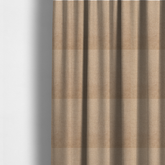 The fabric used to create these made-to-measure curtains is a finely textured weave in a sandy tan or camel shade. The material features a subtle heathered look with mixed light brown, cream, and neutral undertones throughout.
