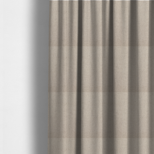 The fabric used to create these made-to-measure curtains is a finely textured weave in a soft greige or light stone shade. The material features a subtle heathered look with tiny flecks of pale grey, cream, and beige undertones throughout.