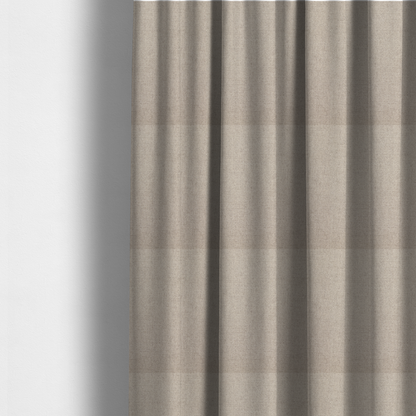 The fabric used to create these made-to-measure curtains is a finely textured weave in a soft greige or light stone shade. The material features a subtle heathered look with tiny flecks of pale grey, cream, and beige undertones throughout.