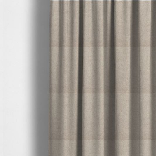 The fabric used to create these made-to-measure curtains is a finely textured weave in a soft greige or light stone shade. The material features a subtle heathered look with tiny flecks of pale grey, cream, and beige undertones throughout.