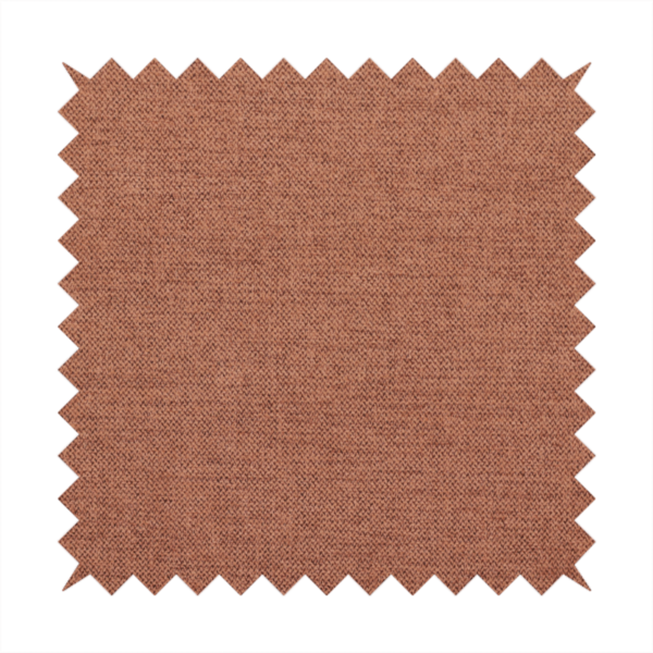 A finely textured weave in a soft terracotta, rust, or muted copper shade. The material features a subtle heathered look with finely blended threads of warm orange-brown and darker neutral undertones throughout.