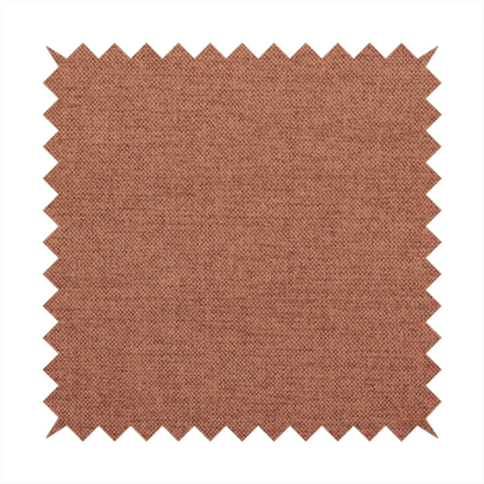 A finely textured weave in a soft terracotta, rust, or muted copper shade. The material features a subtle heathered look with finely blended threads of warm orange-brown and darker neutral undertones throughout.