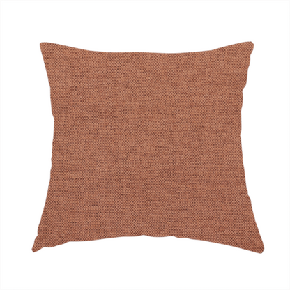 The fabric used to create this handmade cushion is a finely textured weave in a soft terracotta, rust, or muted copper shade. The material features a subtle heathered look with finely blended threads of warm orange-brown and darker neutral undertones throughout.