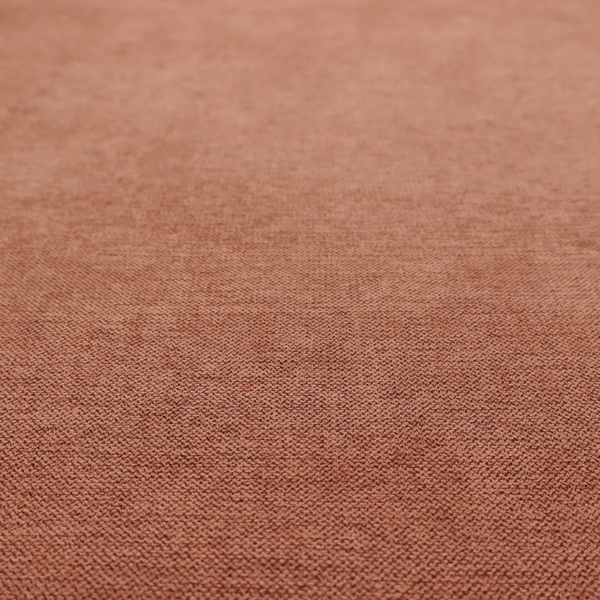 A finely textured weave in a soft terracotta, rust, or muted copper shade. The material features a subtle heathered look with finely blended threads of warm orange-brown and darker neutral undertones throughout.